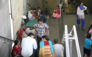 Unattended patients of AIIMS taking shelter at AIIMS metro station. Patients like these fall prey to touts more often. Photo: Anil Shakya