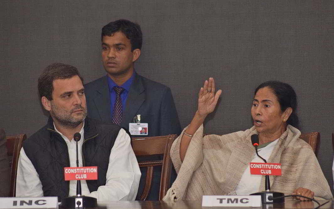Congress vice-president Rahul Gandhi with Trinamool Congress supremo and West Bengal Chief Minister Mamata Banerjee addressing a meeting in New Delhi. Photo: UNI