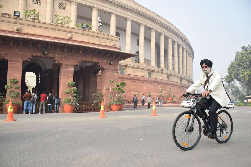 Rajya Sabha member KTS Tulsi arriving at Parliament House on his bicycle. Photo: UNI