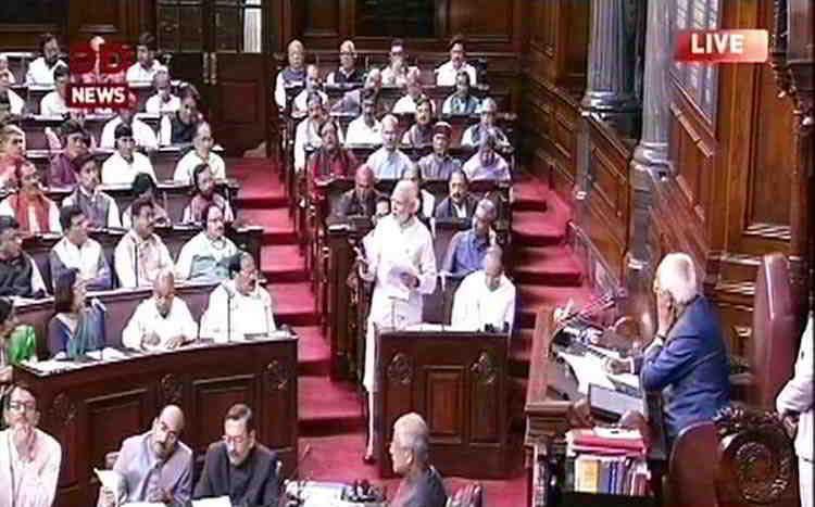 Prime Minister Narendra Modi addressing the Rajya Sabha. The government wants to bypass the Upper House by clearing the Aadhaar Act as a Money Bill. Photo: UNI