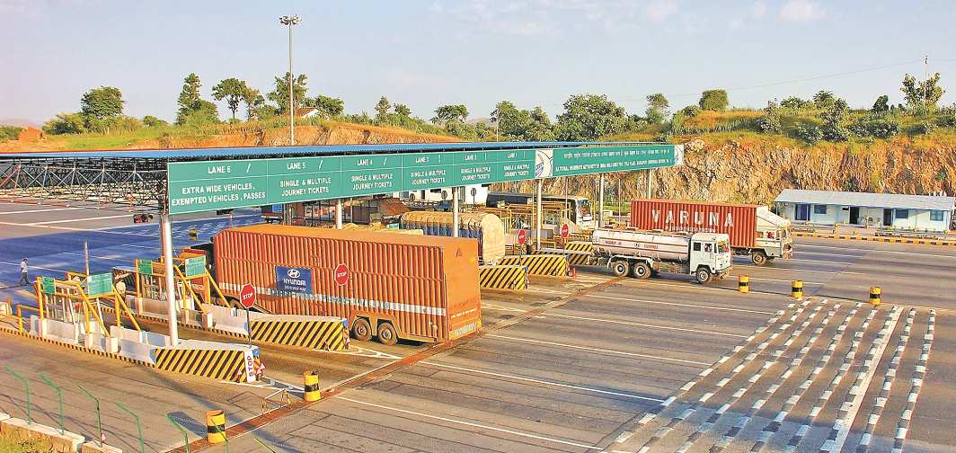 Vehicles halt to pay the toll tax
