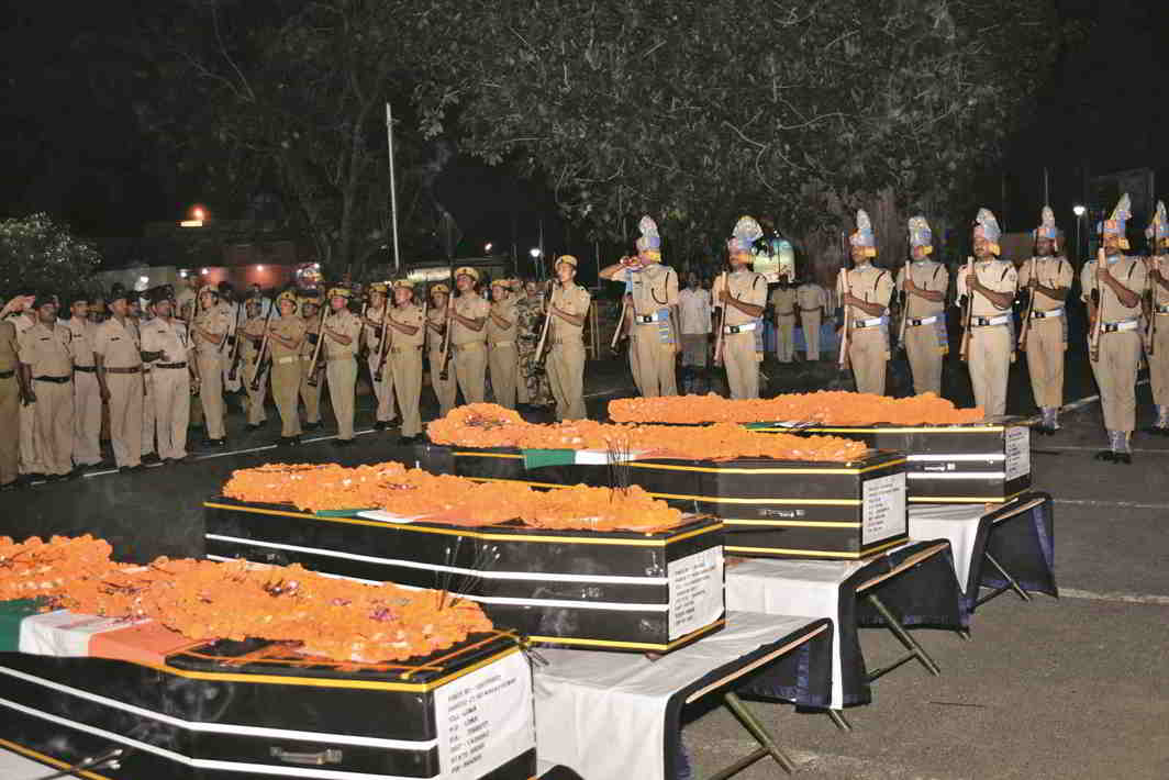Security personnel paying tributes to CRPF jawans killed in Sukma at Patna airport. Photo: UNI