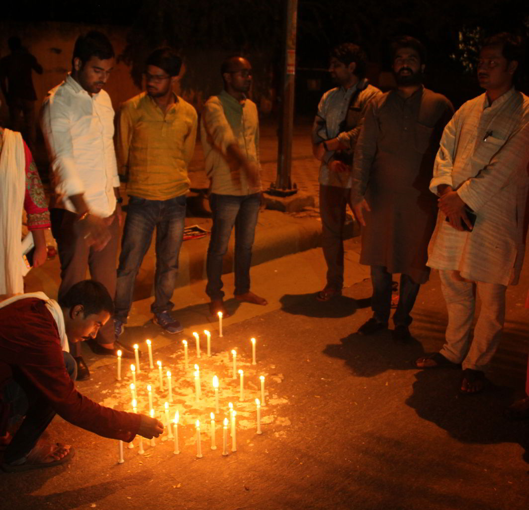 Students of BHU lighting candles to mark their protest against the lathi-charge incident. Photo: Bhavana Gaur
