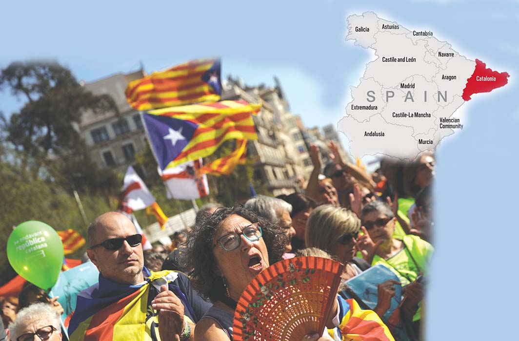 Demonstrators in Barcelona hold up Catalan separatist flags and take part in a gathering in support of the banned October 1 independence referendum. Photo: Rajender Kumar