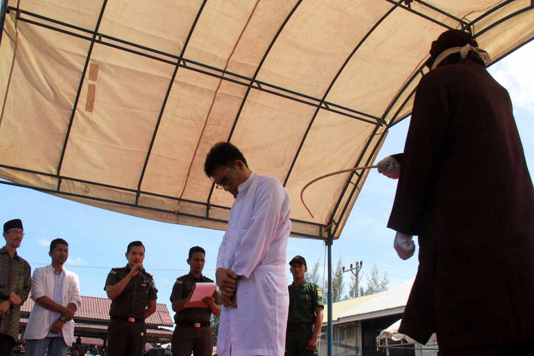 A man being caned for adultery at Al Abrar mosque in Banda Aceh, Indonesia. Photo: UNI