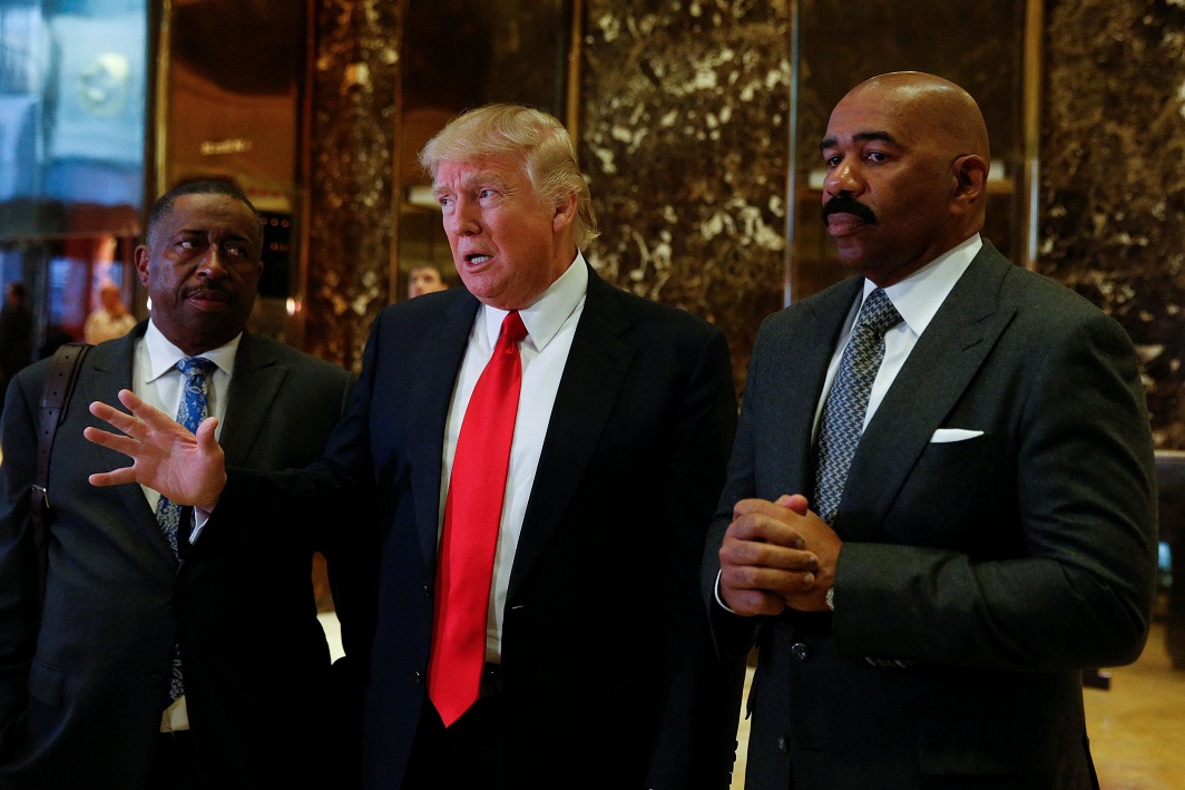 ANOTHER BRUSH WITH MEDIA: US President-elect Donald Trump speaks to members of the news media with television personality Steve Harvey (R) and businessman Greg Calhoun after their meeting at Trump Tower in New York, US, January 13, Reuters/UNI
