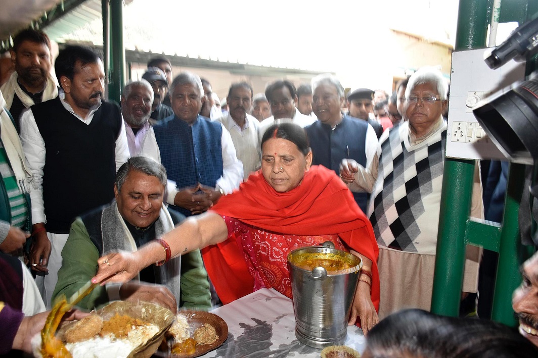 TASTY TREATS: Former Bihar Chief Minister Rabri Devi serves food to Bihar Council Chairman Avdesh Narayan during an event to celebrate Makar Sankranti festival in Patna on January 14, UNI