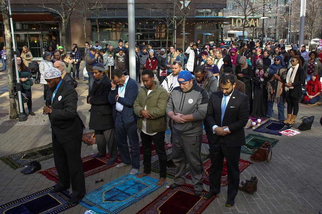 PRAYER FOR JUSTICE: Muslims and interfaith allies participate in a pray-in outside Amazon headquarters in support of Muslim security contractors, including Ismahan Ismael and Essag Hassan who claim to have been treated unfairly due to their religion while working at Amazon, in Seattle, Reuters/UNI