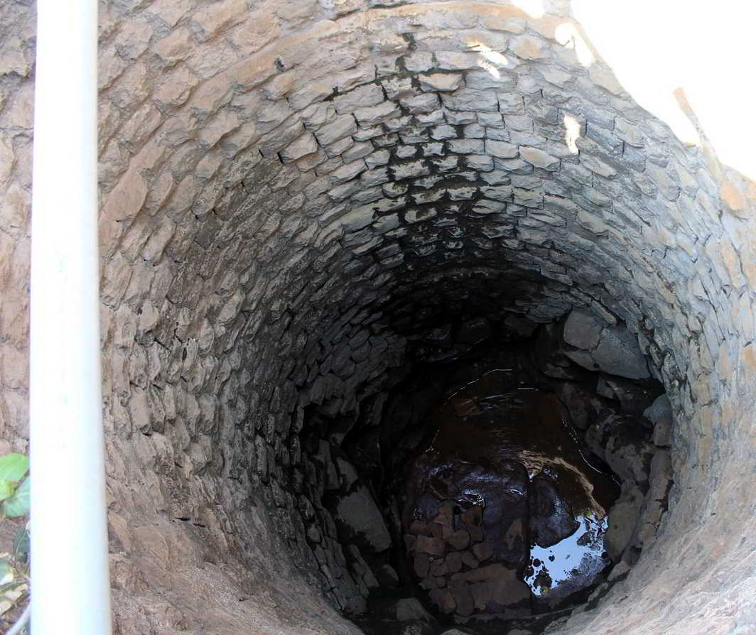 DEEP AND DRY: A well in Belagavi. These are drying up faster creating problems for residents, UNI