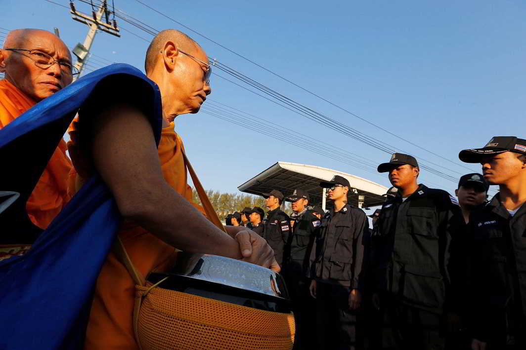 STANDOFF: Thai police block Buddhist monks at the gate of Dhammakaya temple in Pathum Thani province, Thailand, Reuters/UNI