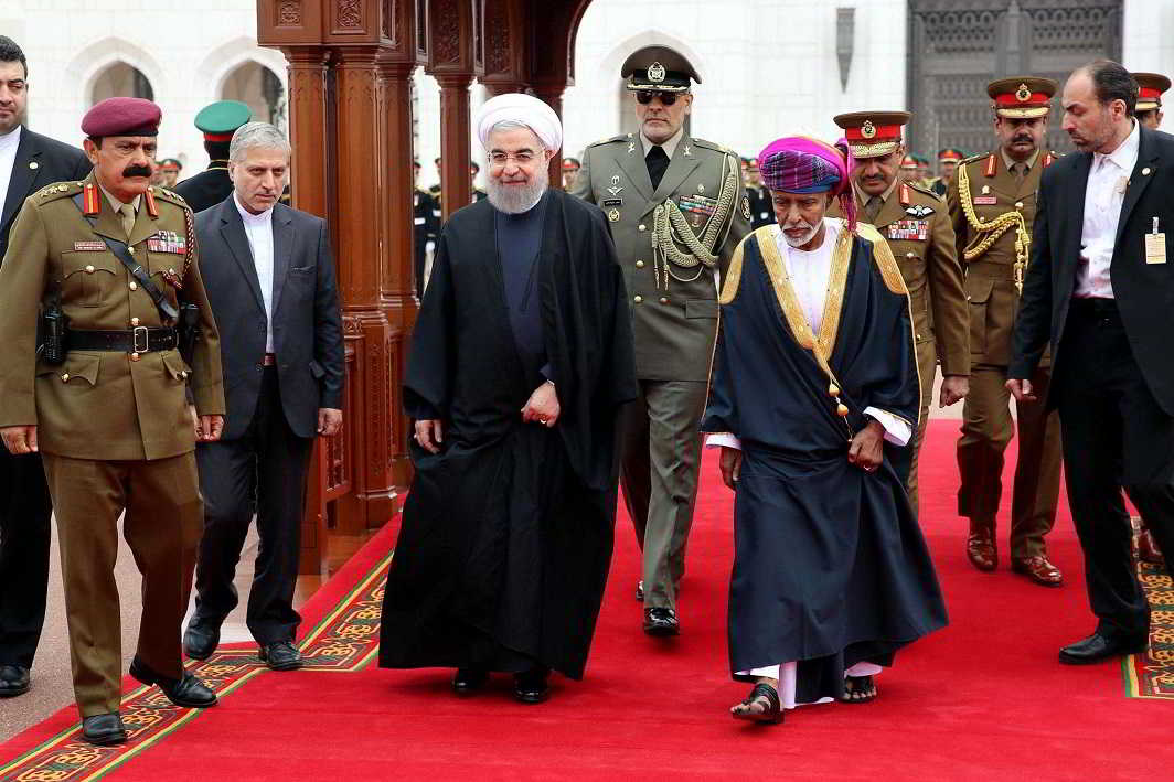 HERE WE COME: Iran’s president Hassan Rouhani walks on the red carpet with Oman's Sultan Qaboos during a welcoming ceremony in Muscat, Oman, Reuters/UNI