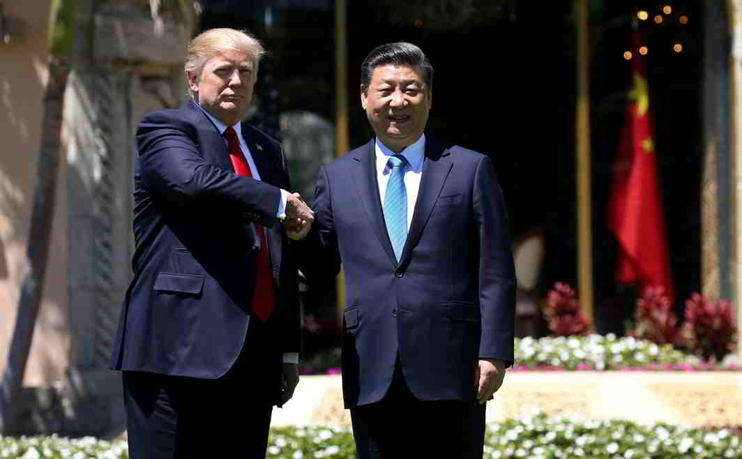 MEETING OF INTERESTS: US President Donald Trump and China's President Xi Jinping shake hands while walking at Mar-a-Lago estate after a bilateral meeting in Palm Beach, Florida, Reuters/UNI