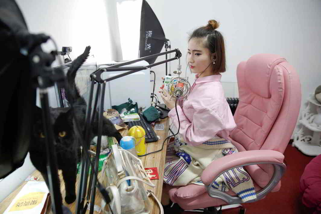 ATTA GIRL! A girl broadcasts material at live streaming talent agency Three Minute TV in Beijing, Reuters/UNI