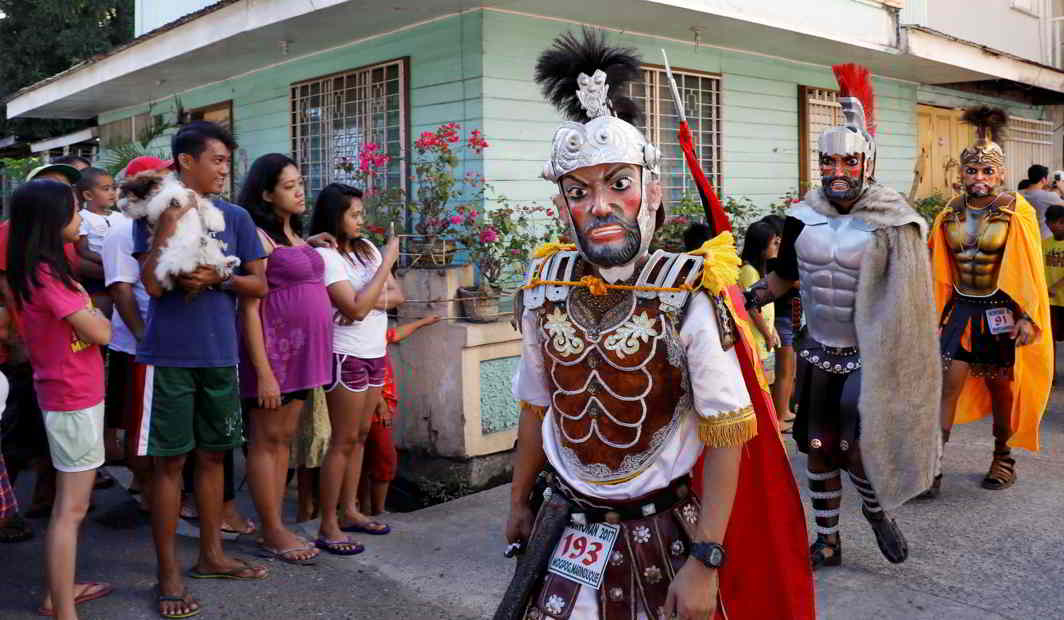 TALES FROM THE BIBLE: Residents watch penitents wearing masks and centurion costumes during a local Lenten ritual called "Moriones" in Mogpog, Marinduque, Philippines, Reuters/UNI