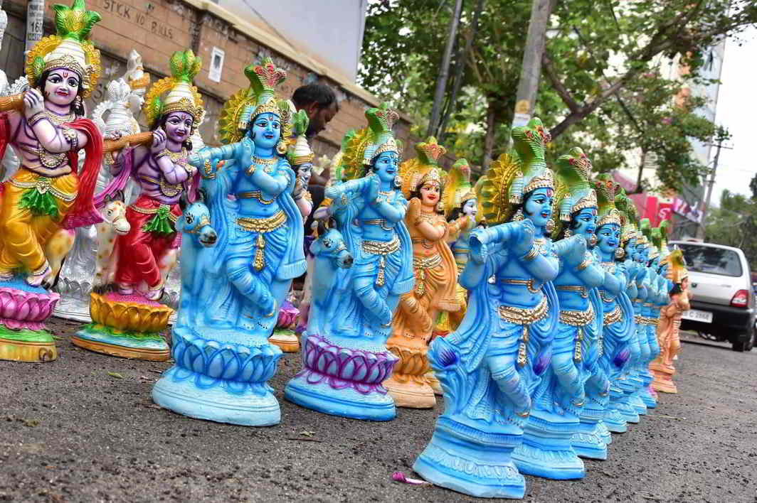 WHICH GOD DO YOU CHOOSE? Krishna idols for sale on the pavements of Thiruvananthapuram on the eve of Vishu, UNI