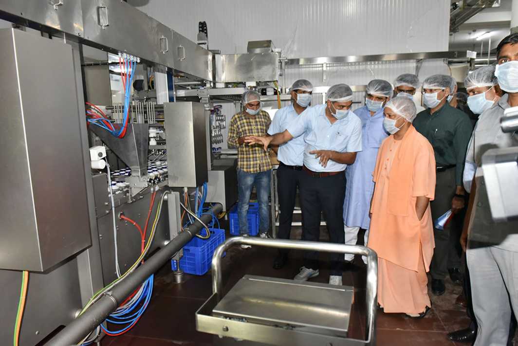 FOCUS OF ATTENTION: Uttar Pradesh chief minister Yogi Adityanath inspects the Amul dairy unit in Lucknow, UNI