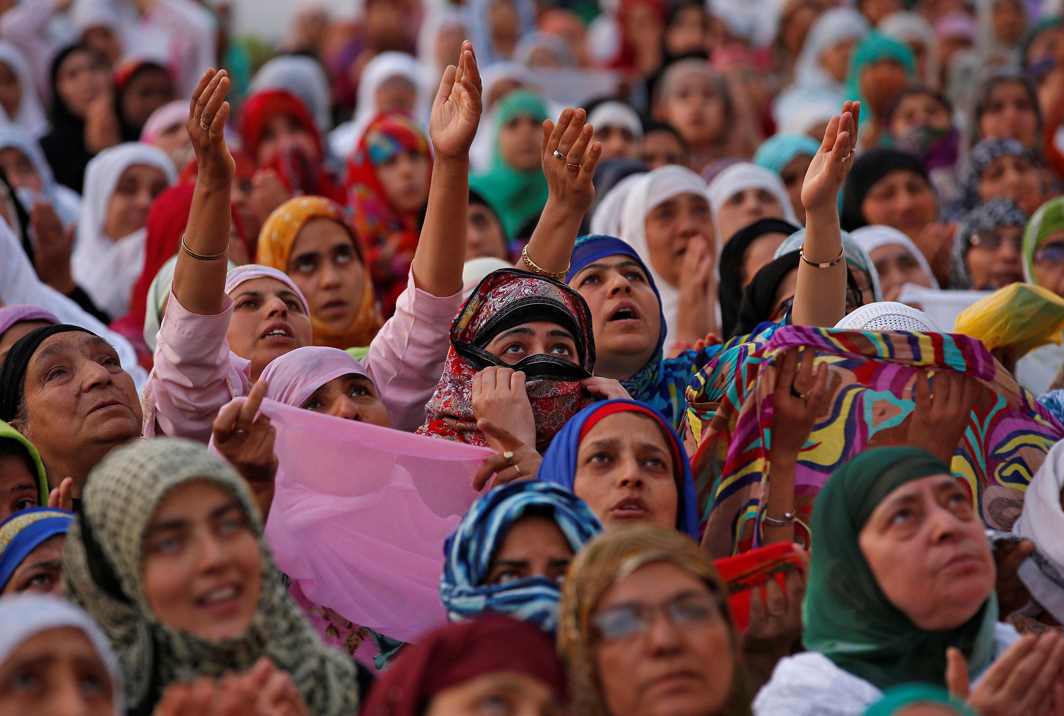 RAW PIETY: Kashmiri Muslim women pray upon seeing a relic, believed to be a hair from the beard of Prophet Mohammad, displayed to devotees on the death anniversary of Hazrat Ali, son-in-law of Prophet Mohammad, at Hazratbal shrine during the holy month of Ramzan in Srinagar, Reuters/UNI