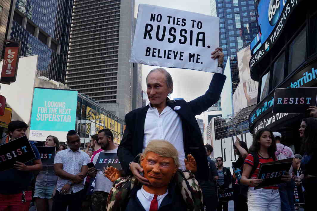 PROTESTING PREJUDICE: A participant dressed as both Russia's President Vladimir Putin and US President Donald Trump attends a protest against Trump's announcement that he plans to reinstate a ban on transgender individuals from serving in any capacity in the US military, in Times Square, New York City, Reuters/UNI
