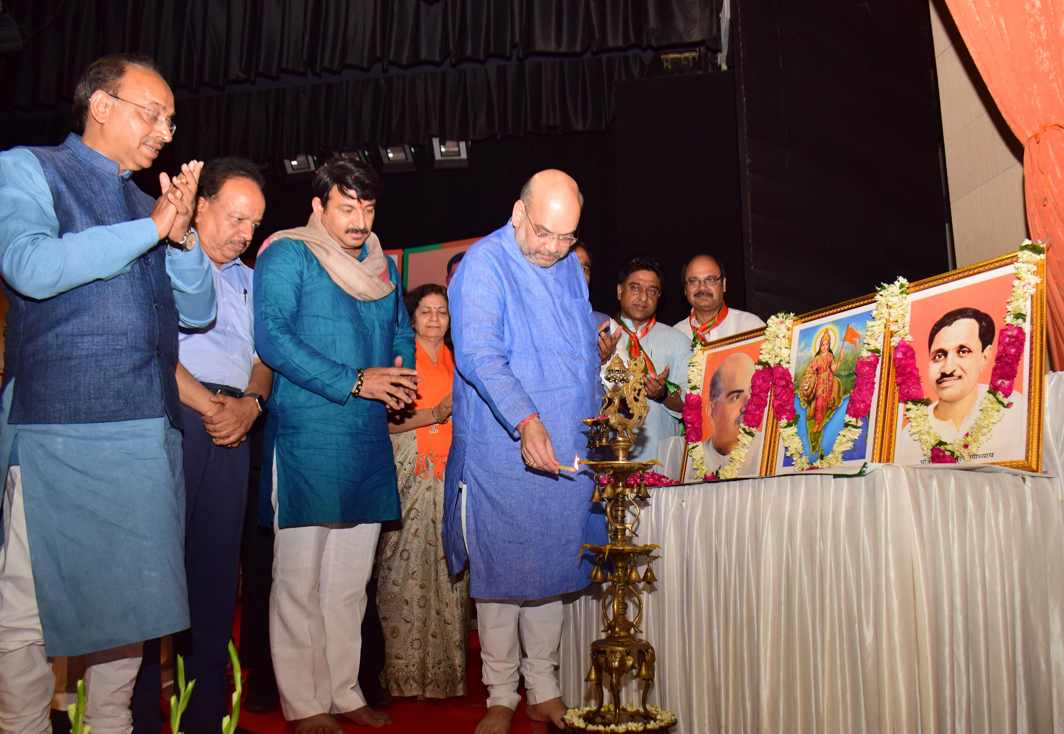 CEREMONY IS MUST: BJP president Amit Shah lights the ceremonial lamp to inaugurate the group meeting of Delhi BJP workers, in New Delhi, UNI