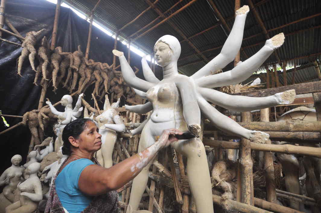 AT WORK: A woman sculpts an idol of Goddess Durga in Agartala, UNI