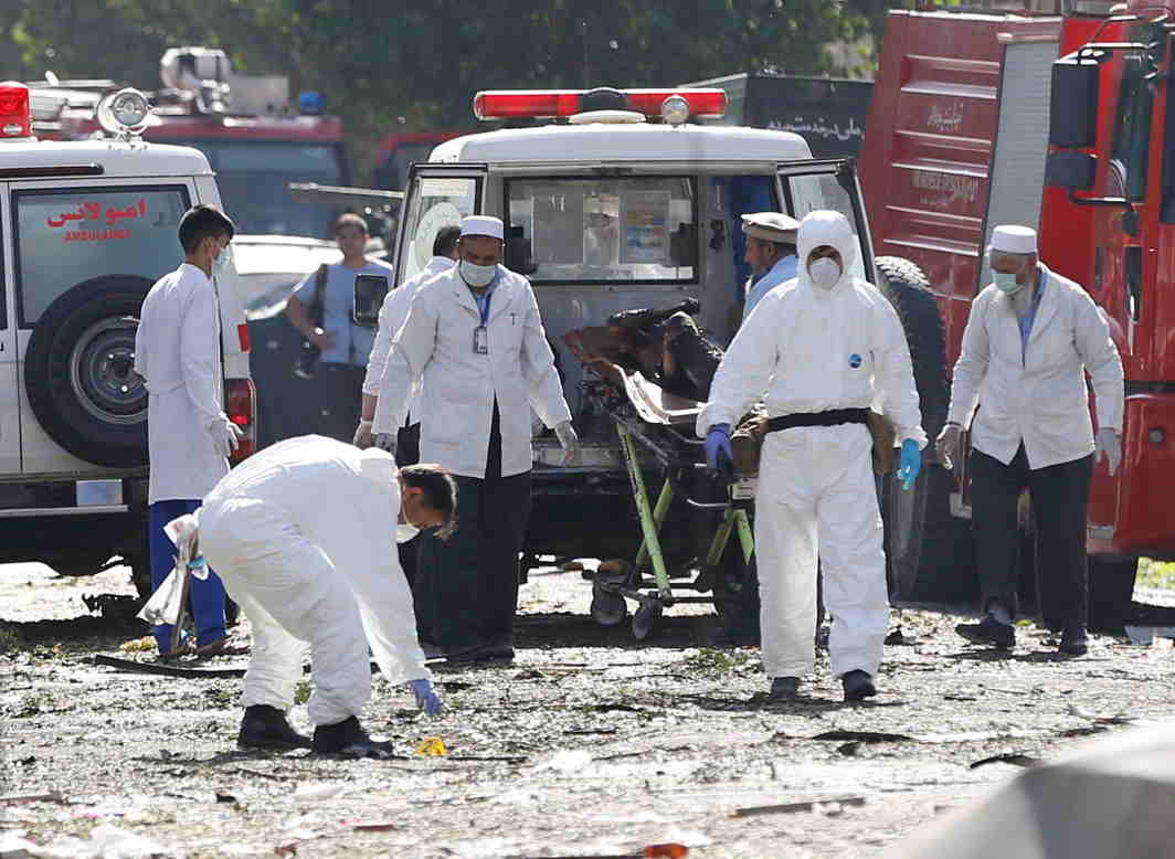 AFTER THE TRAGEDY: Afghan investigators work at the site of a suicide attack in Kabul, Afghanistan, Reuters/UNI