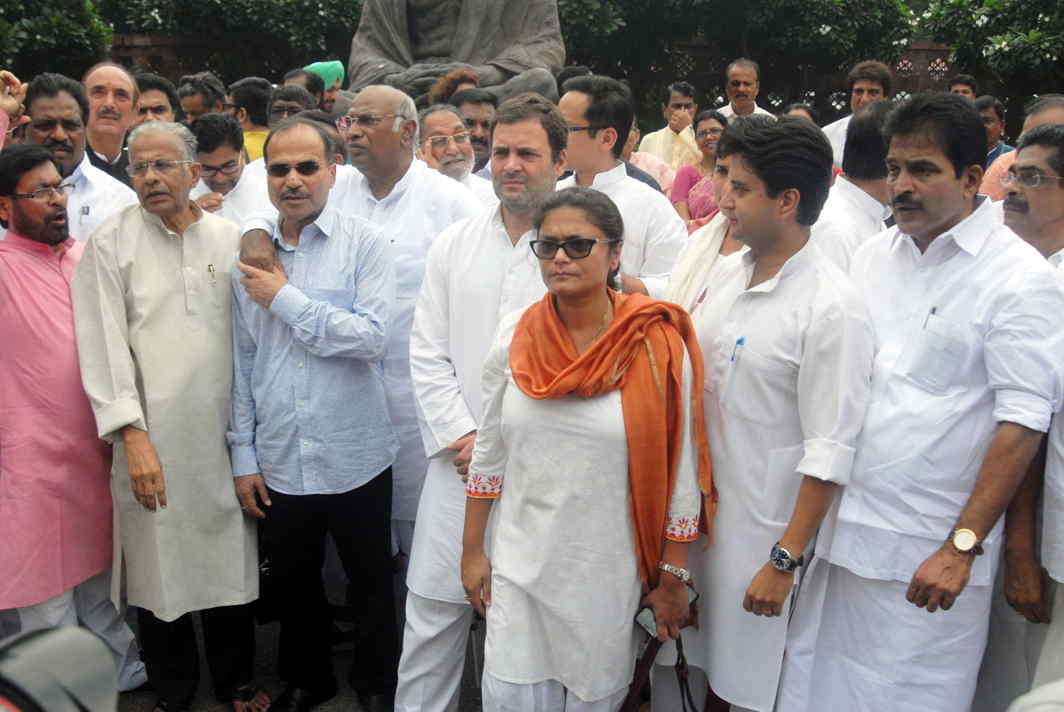 UP AND ABOUT: Congress vice-president Rahul Gandhi, alongwith Lok Sabha Opposition leader Mallikarjun Kharge, Rajya Sabha Opposition leader Ghulam Nabi Azad and MPs of Congress and other opposition parties, stages a demonstration in protest against the suspension on six Congress MPs, at Parliament House in New Delhi, UNI