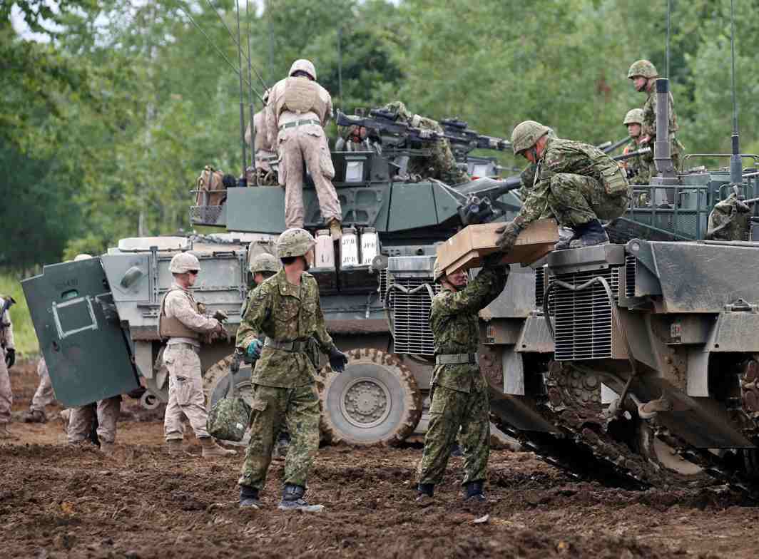 FIGHT PLAN: US Marine Corps and Japan Ground Self Defense Force (front) personnel take part in a joint exercise named Northern Viper 17 at Hokudaien exercise area in Eniwa, on the northern island of Hokkaido, Japan, Reuters/UNI