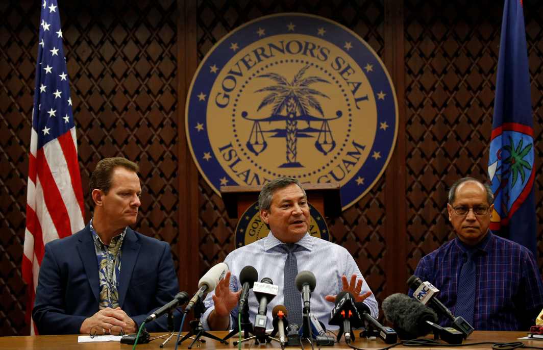 UNDER N-THREAT: Guam Governor Eddie Calvo (C) addresses a news conference at a government centre in Adelup district on the island of Guam, a US Pacific Territory, Reuters/UNI