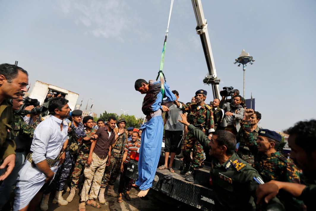 COMEUPPANCE: Hussein al-Sakit, 22, who was convicted of raping and murdering a five-year-old girl is hanged on a crane at Tahrir Square in downtown Sanaa, Yemen, Reuters/UNI