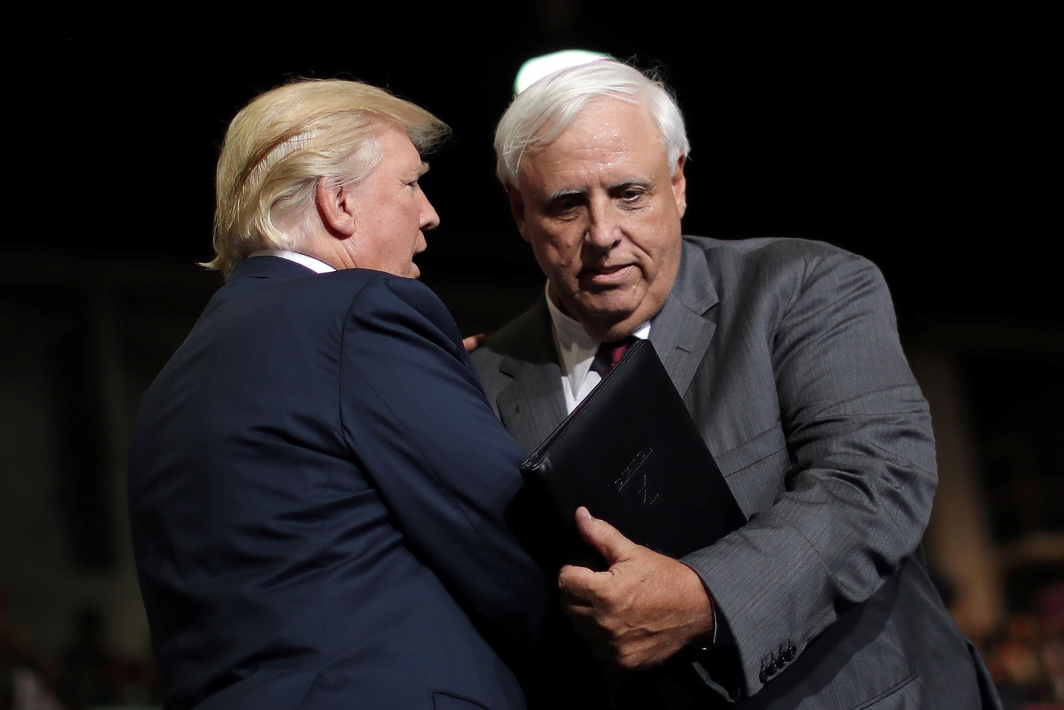 CROSSING THE FLOOR: US President Donald Trump with West Virginia's Democratic Governor Jim Justice after he announced that he is changing parties during a rally in Huntington, West Virginia, Reuters/UNI