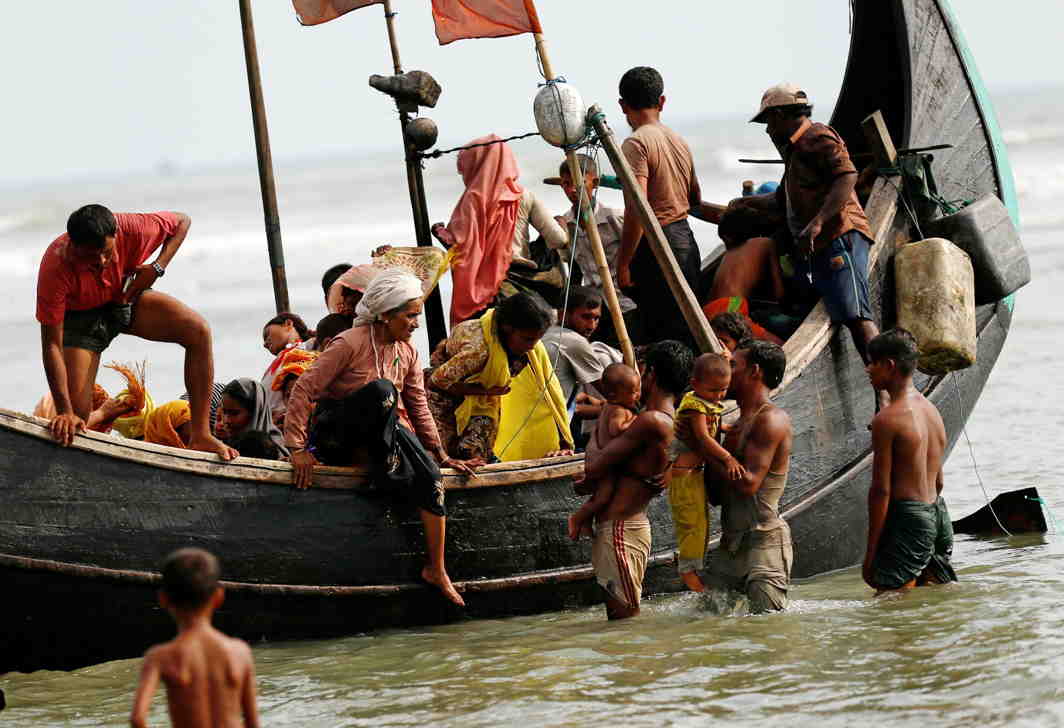 UNTOLD SUFFERING: Rohingya refugees arrive in Bangladesh by boat through the Bay of Bengal in Teknaf, Reuters/UNI