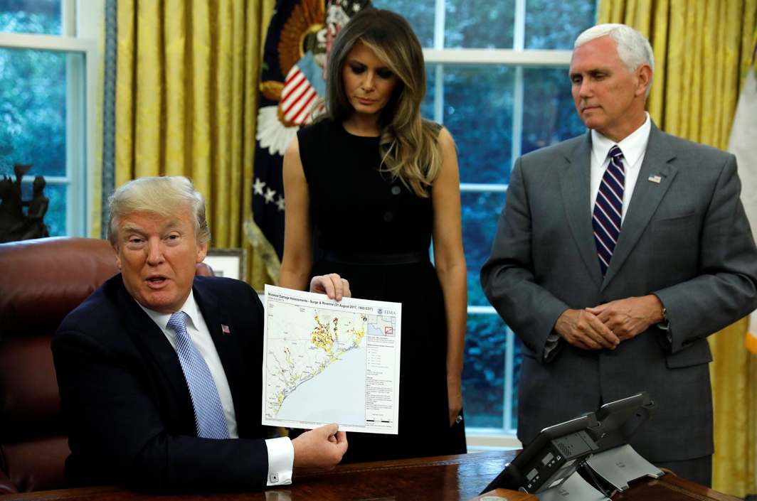 TRAIL OF DESTRUCTION: US First Lady Melania Trump and vice-president Mike Pence stand by US President Donald Trump as he holds up the FEMA map of damage assessment in Texas caused by Hurricane Harvey at the White House in Washington, US, Reuters/UNI