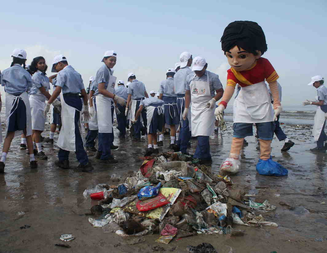 GOOD DEEDS: Cartoon director Shiva alongwith volunteers of a NGO cleans Juhu Beach post immersion of Ganesh idols in Mumbai, UNI