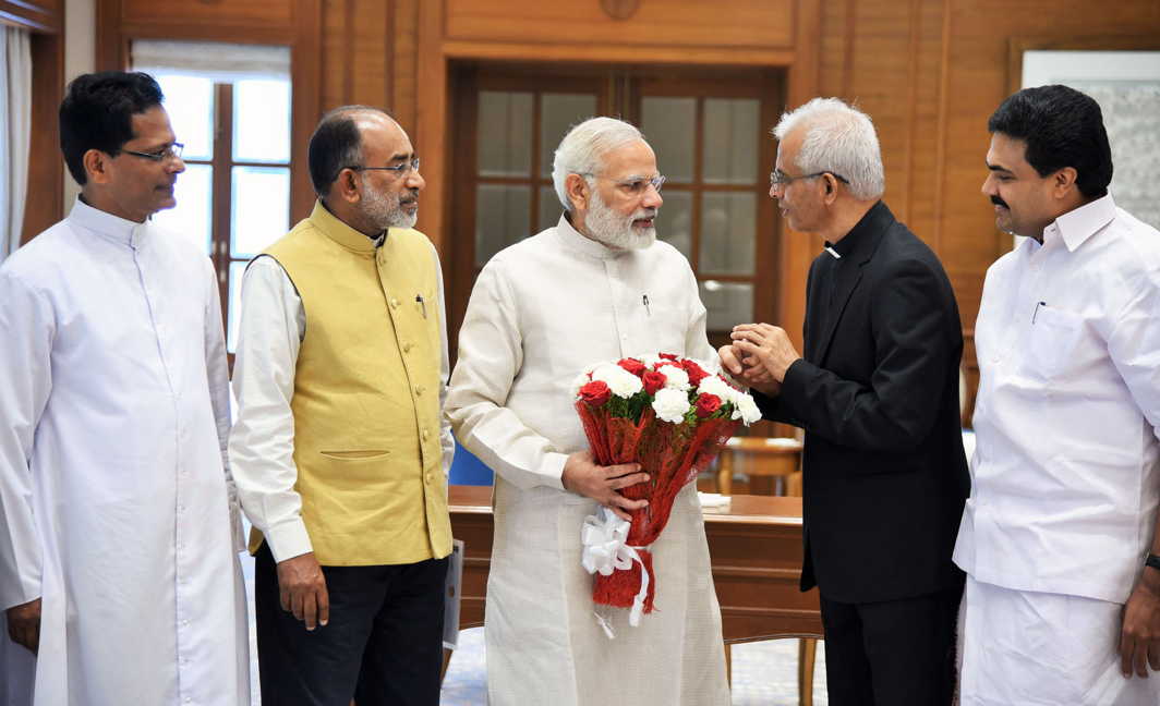 FREE FROM ISIS CLUTCHES: Prime Minister Narendra Modi meets Father Tom Uzhunnalil, who was recently rescued from captivity in Yemen, UNI