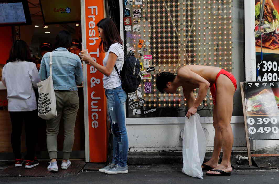 DOING MY BIT: A participant wearing the traditional "fundoshi" or loin cloth attends an event to pick trash on the streets in Tokyo, Reuters/UNI