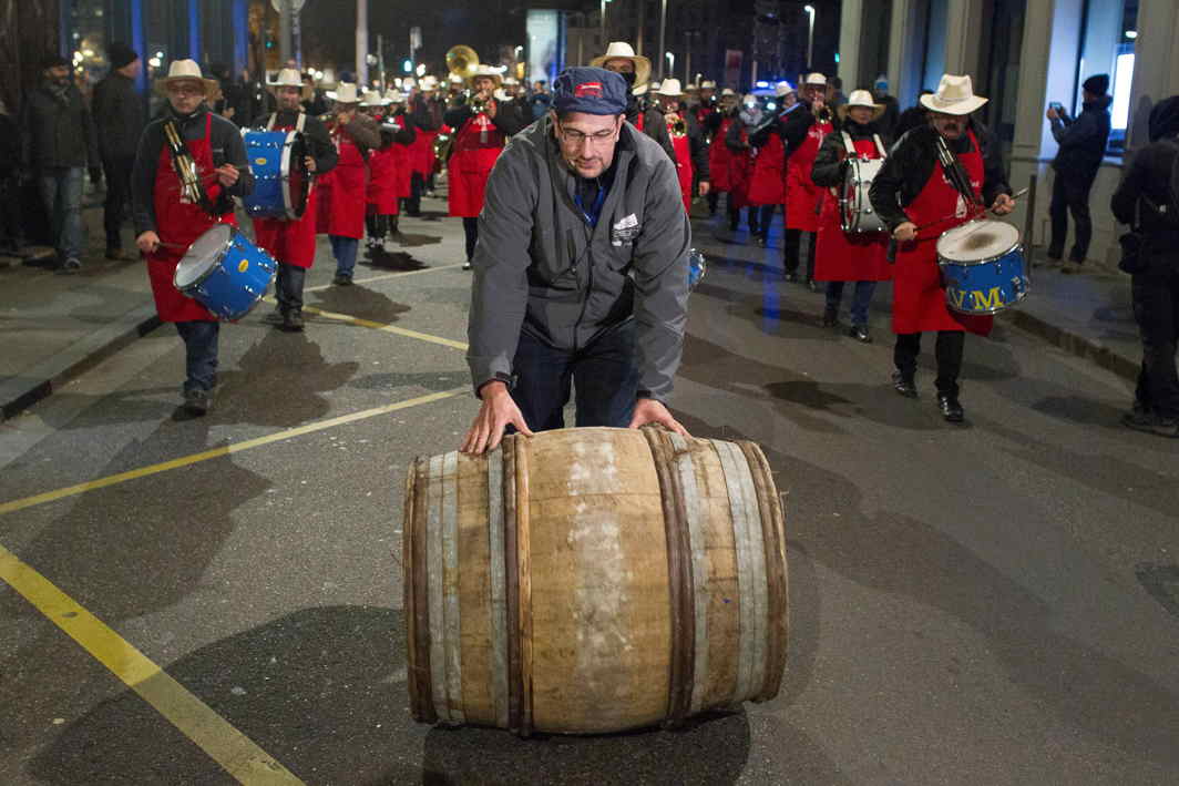 DRINK AND BE MERRY: Musicians perform as a man rolls a barrel of Beaujolais Nouveau wine for the official launch of the 2017 vintage in the center of Lyon, France, Reuters/UNI