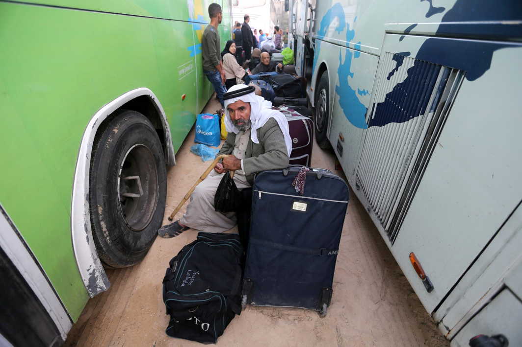 IN TRANSIT: Palestinians wait for travel permits to cross into Egypt, for the first time after Hamas ceded Rafah border crossing to the Palestinian Authority, in Khan Younis in the southern Gaza Strip, Reuters/UNI