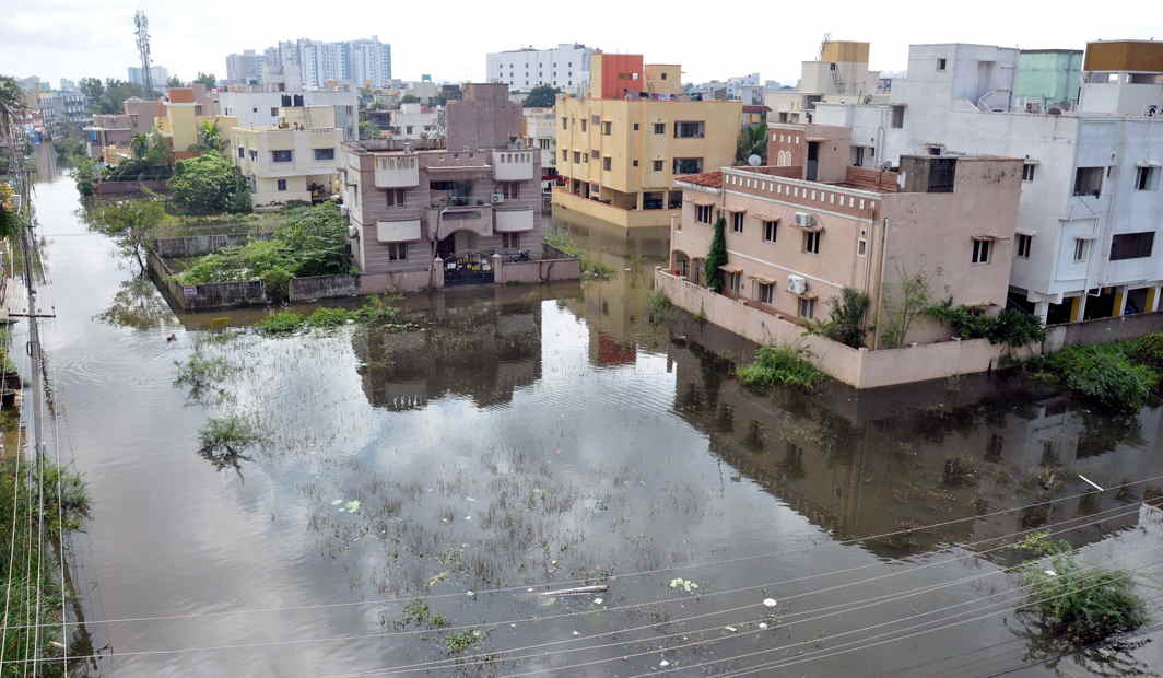WET SPELL: A view of a waterlogged residential area at Velacherry following heavy rains, in Chennai, UNI
