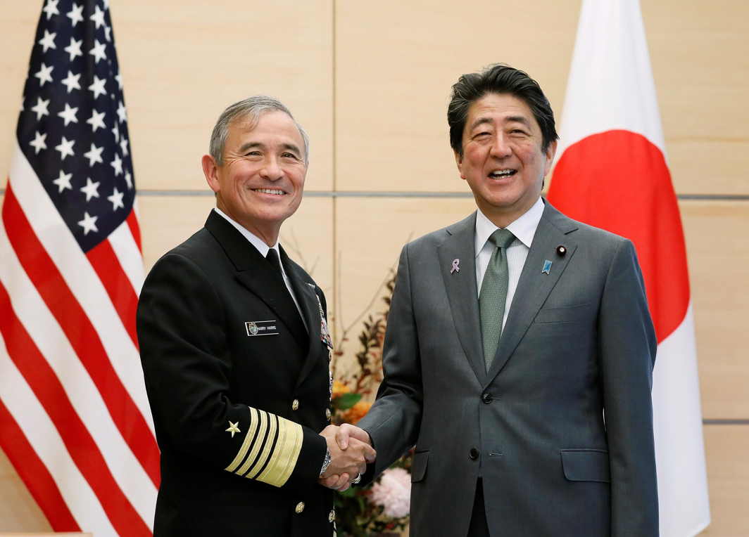 MEETING OF INTERESTS: Japanese Prime Minister Shinzo Abe shakes hands with Harry Harris (L), the 24th Commander of United States Pacific Command (USPACOM), as Harris makes a courtesy visit to Abe at the prime minister's official residence in Tokyo, Japan, Reuters/UNI