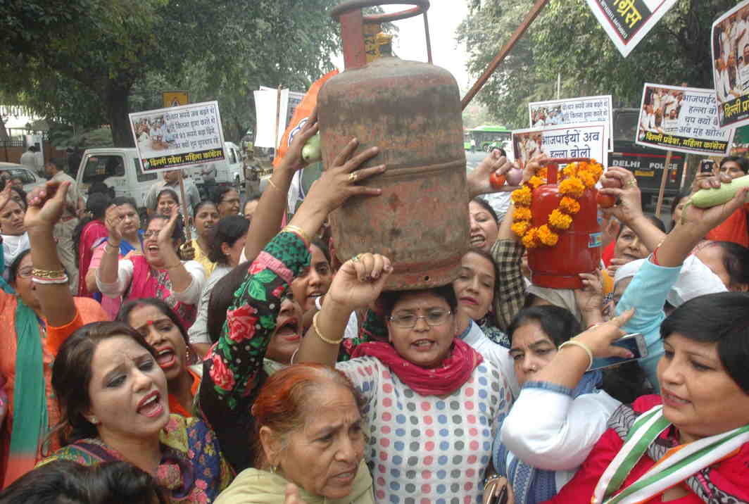 HEAVY LIFTING: Delhi Pradesh Mahila Congress activists raise slogans during a demonstration near the BJP headquarters in protest against the rising price of LPG and essential commodities, in New Delhi, UNI