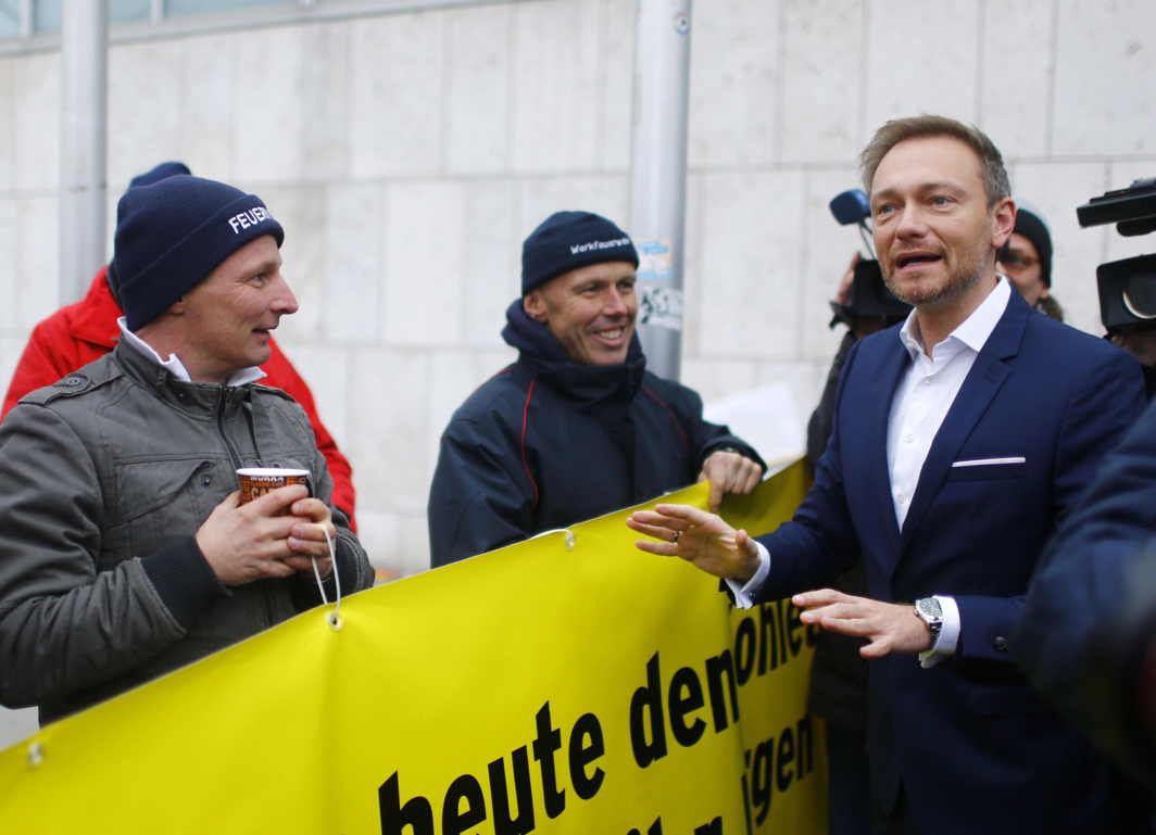 TALKING SUPPORT: Chairman of the Free Democratic Party (FDP) Christian Lindner talks with people gathered outside the CDU headquarters, as he arrives for exploratory talks about forming a new coalition government in Berlin, Germany, Reuters/UNI