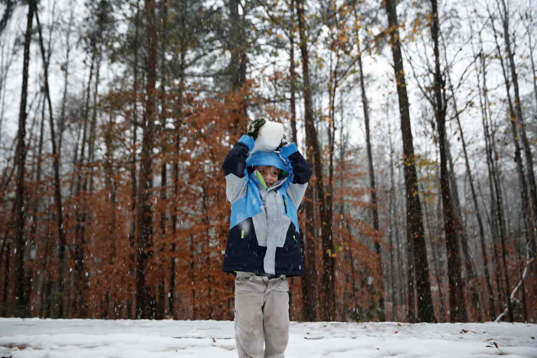 WHITE MAGIC: A seven-year-old plays in the snow near Atlanta in Tucker, Georgia, US, Reuters/UNI