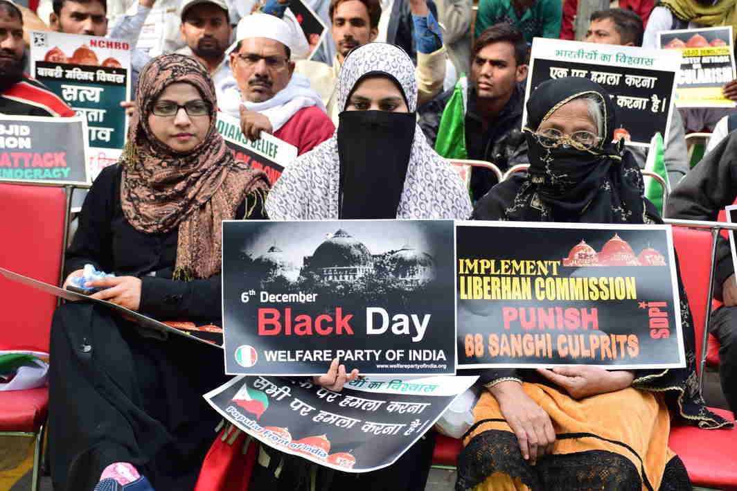 BOUND BY FAITH: Social Democratic Party of India activists hold a demonstration in Parliament Street demanding rebuilding of the Babri Masjid on the 25th anniversary of its demolition, in New Delhi, UNI
