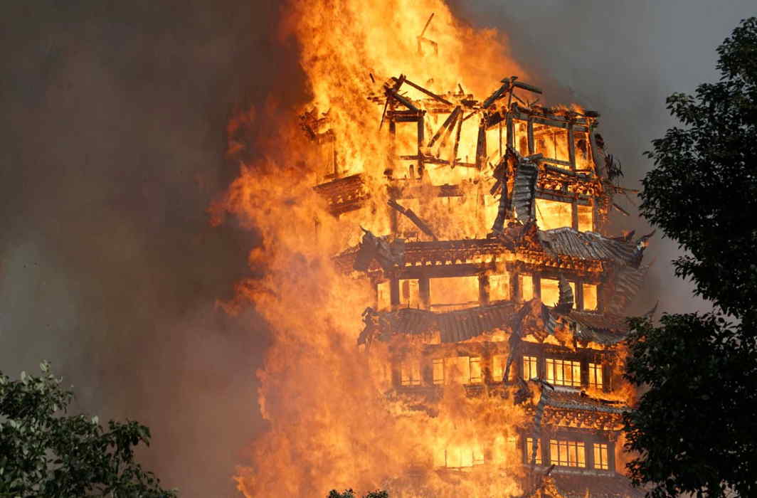 UP IN FLAMES: A temple under construction is seen engulfed in fire in Mianzhu, Sichuan province, China, Reuters/UNI