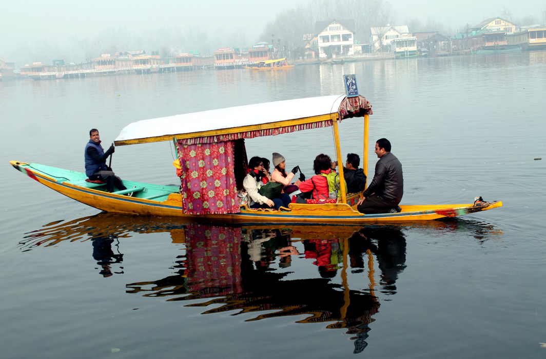 RECREATION: Foreigners enjoy a shikara ride in the world famous Dal Lake, during a cold winter morning in Srinagar, UNI