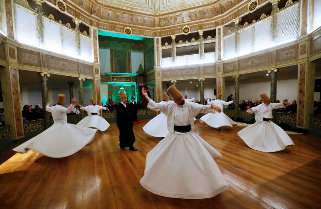 DANCE OF THE DEVOUT: Whirling dervishes perform a "sema" ritual during a ceremony, one of many marking the 744th anniversary of the death of Mevlana Jalaluddin Rumi, at Galata Mevlevi Temple in Istanbul, Turkey, Reuters/UNI