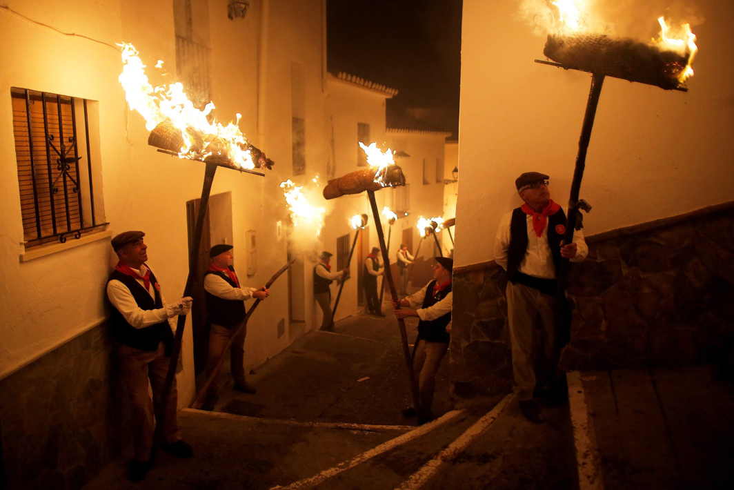 VIRGIN’S VIGIL: Villagers hold torches to represent light and vision during the Divina Pastora procession, as part of a festival to honour the Virgin of Los Rondeles, on the eve of St Lucia's Day, in Casarabonela, near Malaga, southern Spain, Reuters/UNI