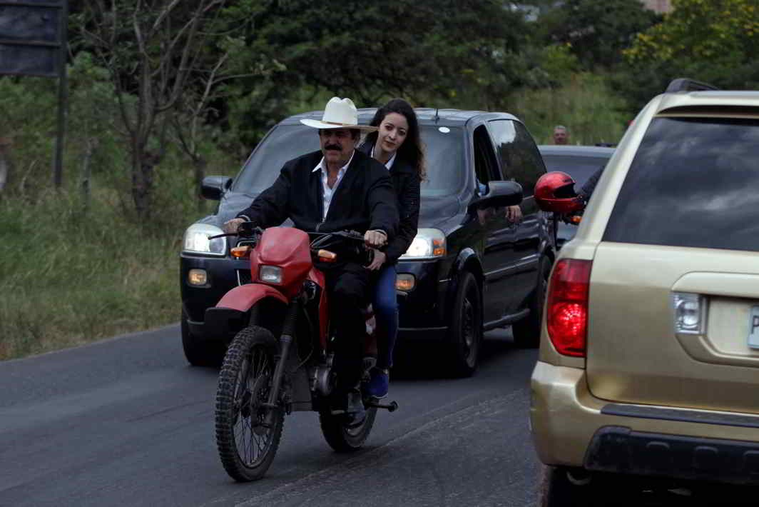 WHAT A GIRL WANTS: Honduras' former president Manuel Zelaya and his daughter Hortensia ride a motorcycle while arriving at an opposition protest over a contested presidential election with allegations of electoral fraud in Tegucigalpa, Honduras, Reuters/UNI