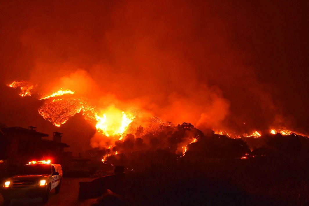 DESTRUCTION IN ITS WAKE: The Thomas wildfire burns above Bella Vista Drive near Romero Canyon in this social media photo by Santa Barbara County Fire Department in Montecito, California, US, Reuters/UNI