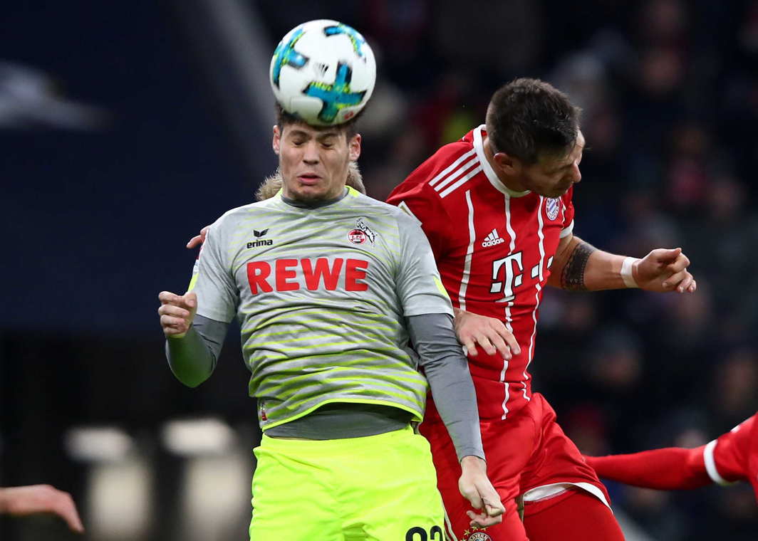 BEAUTIFUL GAME: Cologne's Jorge Mere in action against Bayern Munich's Niklas Sule during a Bundesliga match in Munich, Germany, Reuters/UNI